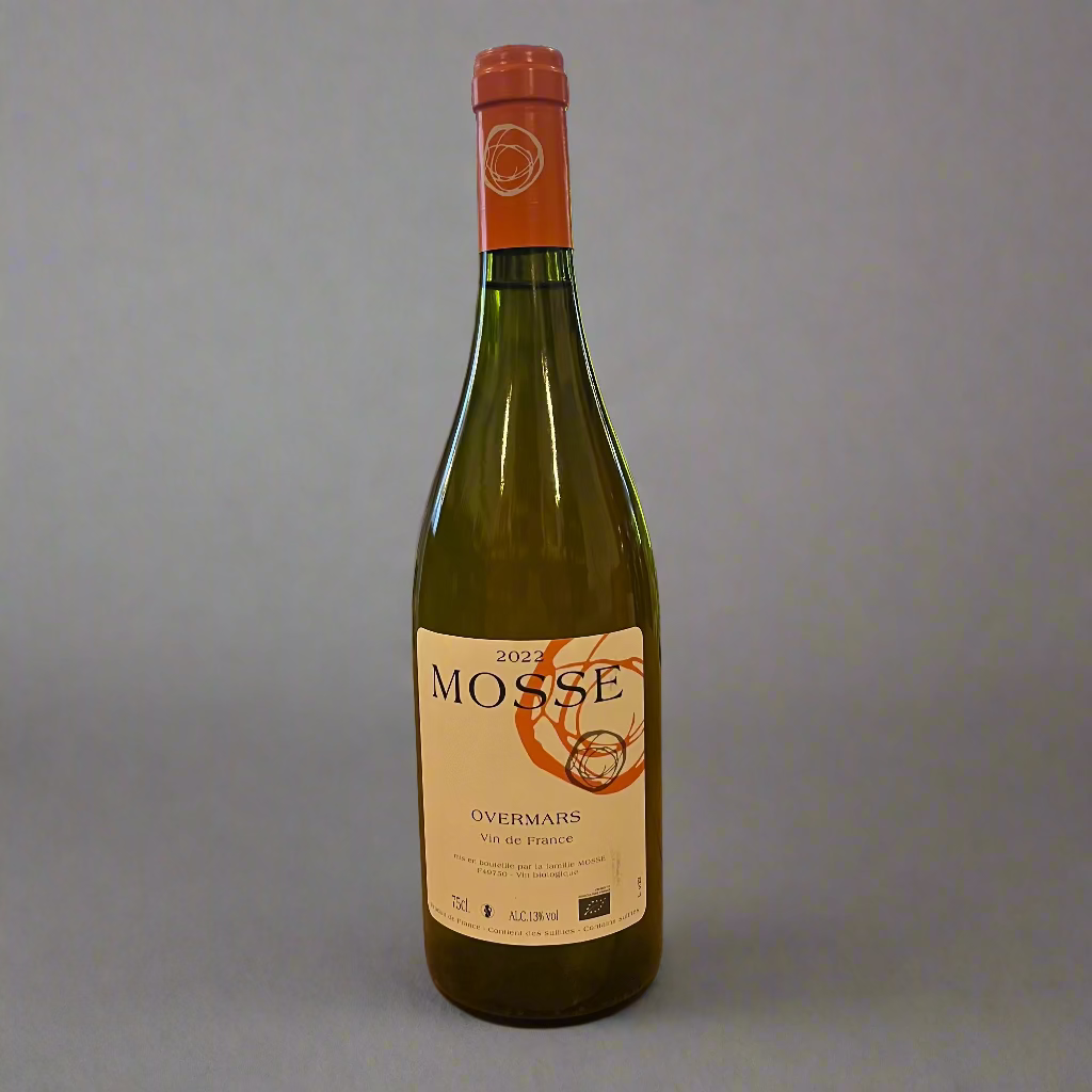 Bottle of Mosse wine on a wooden table with a store interior in the background