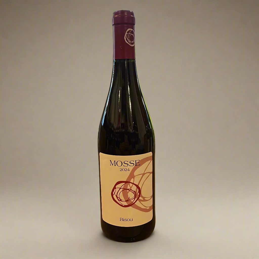 Wine bottle labeled 'MOSSE' on a wooden table with a store interior in the background