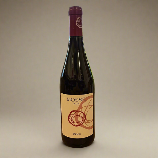 Wine bottle labeled 'MOSSE' on a wooden table with a store interior in the background