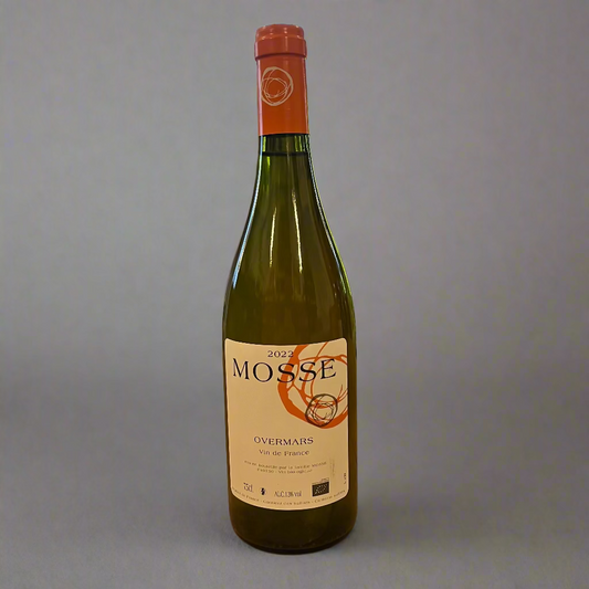 Bottle of Mosse wine on a wooden table with a store interior in the background